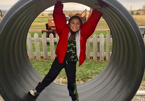 A girl plays at the Back 40 Fun Acres at Tanners Orchard, which provides Fall activities for Freeport IL residents