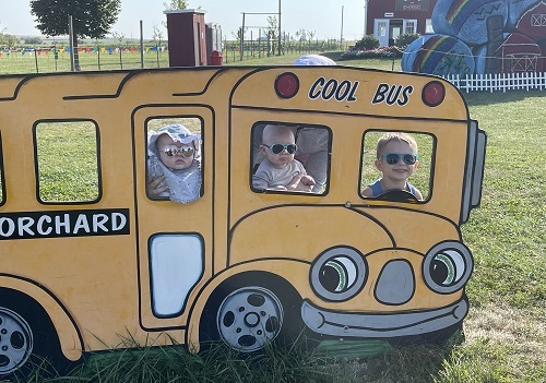 Children post in front of a photo op at Tanners Orchard, which provides Fall activities for Freeport IL residents