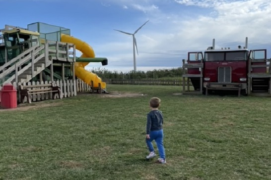 A child explores the grounds of Tanners Orchard, which offers Family Activities for Aurora IL residents and beyond