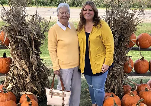 A woman and her granddaughter enjoy Tanner's Orchard's Fall Activities by Champaign IL