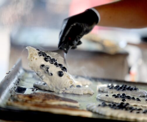 Cook at Tanners Orchard preparing blueberry pancakes
