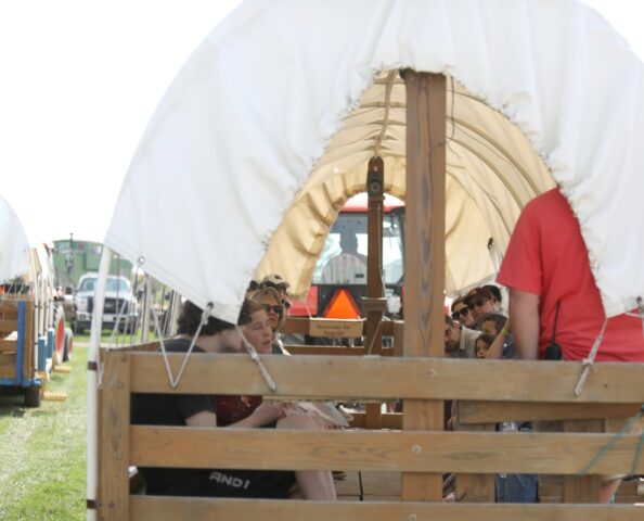 A wagon carrying people to the apple-picking section of the orchard at Tanners